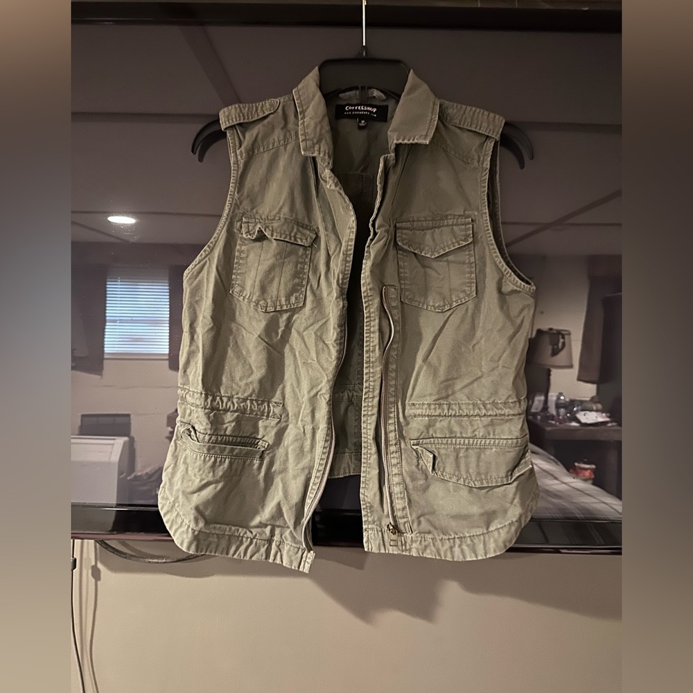 Army green vest. Like new. Brand is coffee shop.